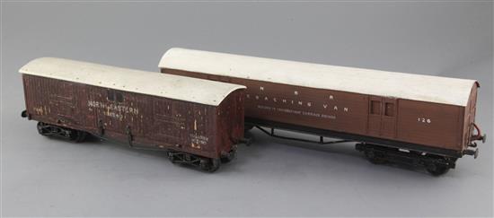 A North Eastern baggage van, no. 106340, in brown and a North British Railway coaching van, no. 126, in brown